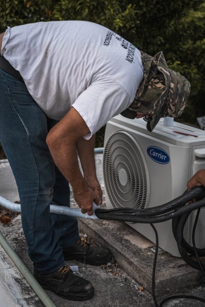 man-taping-a-hose-5463576 furnace repair durango